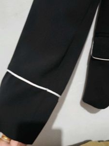 Chic Black Blazer with White Piping