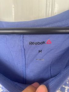 Reebok light purple T-Shirt with Silver Grid Print