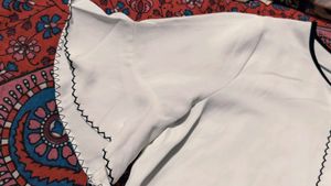 Chic White Blouse with Black Trim