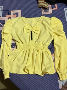 Chic Yellow Peplum Top with Bow Detail
