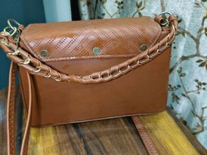 Chic Brown Crossbody Bag with Perforated Design