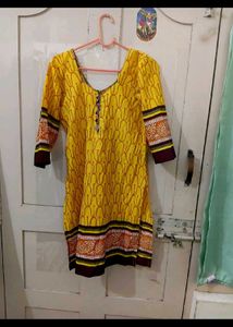 a )Yellow Printed Kurti with knot at back
