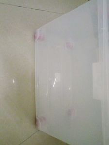 Clear Storage Bin with Assorted Contents