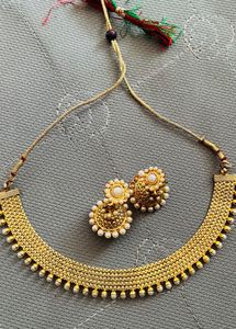 gold jewellery necklace with earrings