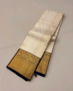 Elegant Off-White Saree with Gold Border