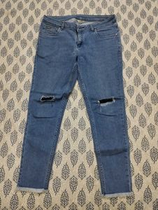 Distressed Blue Narrow Jeans