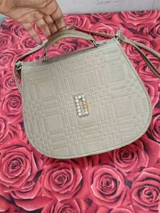 Gold sling bag