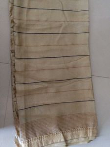 Elegant Beige Saree with Subtle Motifs