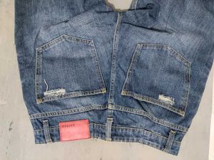 Distressed Blue Denim Jeans