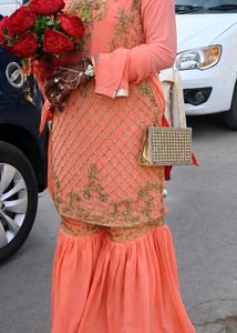 Exquisite Peach Embellished Sharara Set