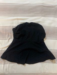 Two peplum  tops in black and white