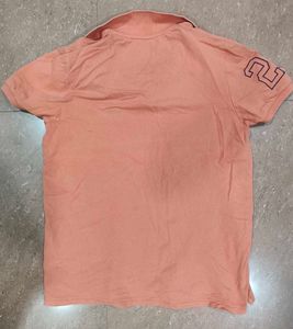 Orange Polo Shirt with "Finest Make" Print