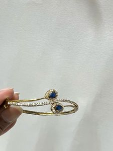 Elegant CZ and Sapphire Bangle