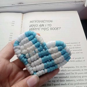 Heart-shaped bookmark on book page