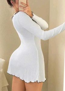 Chic Ribbed White Mini Dress with Bow Detail