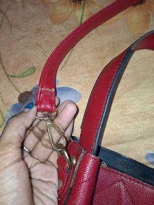 The red quilted hobo handbag