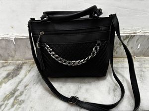 Chic Black Handbag with Chain Detail