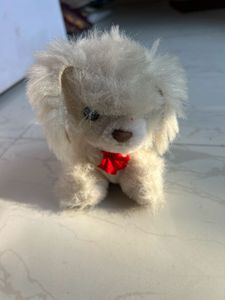 Adorable White Plush Dog Toy with Red Bow
