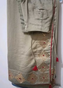 Elegant Beige Saree with Gold Embellishments