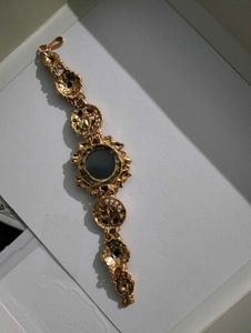 Exquisite Gold Tone Watch with Gemstones