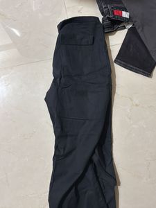 Black trendy parachute pants with adjustable lows