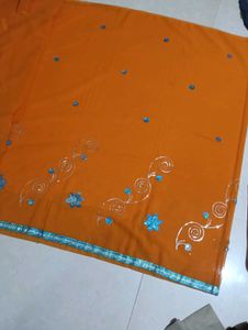 Orange Saree with Blue Embellishments