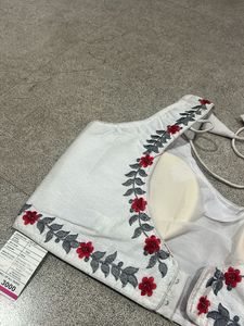 Embroidered White Sleeveless Blouse