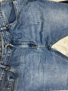 Blue Denim Jeans with Distressed Detail