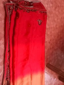 Elegant Red Saree with Crystal Embellishments