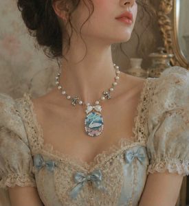 Enchanted Swan Lake Clay Pendant Bow Necklace