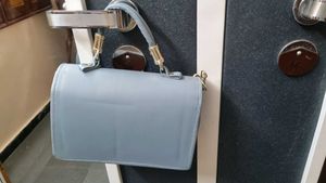 Stylish Light Blue Handbag with Gold Chain