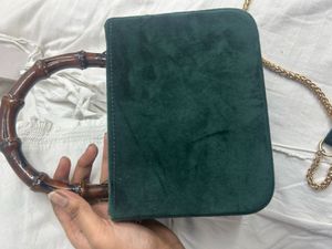 Elegant Green Suede Bag with Bamboo Handle