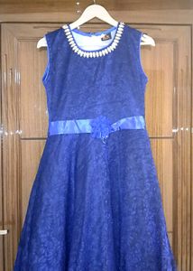 Navy Blue Gown With A Flower.