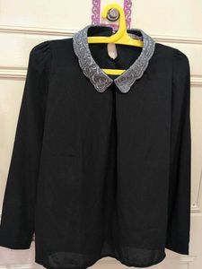 Chic Black Top with Embellished Collar