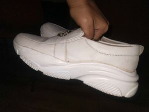 White slip-on shoes with embellishments