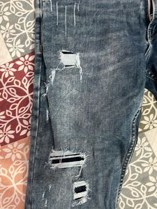 Distressed Blue Denim Jeans