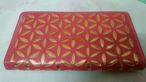 A beautiful pink and golden wallet