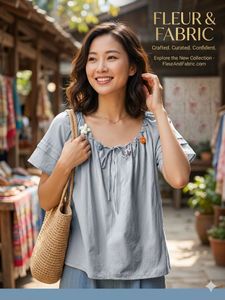 Chic Grey Blouse with Floral Embellishments