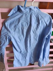 Light Blue Button-Up Shirt with Floral Detail