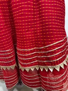 Red lehenga with matching dupatta and golden blous