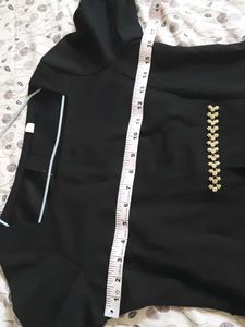 Elegant Black Peplum Top with Embellishments