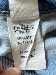 Women's Blue Distressed Jeans with Patch