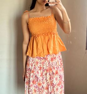 Orange Smocked Peplum Top
