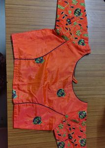 Cream saree with orange blouse
