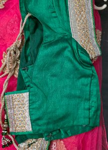 Pink net saree with blouse and satin peticot