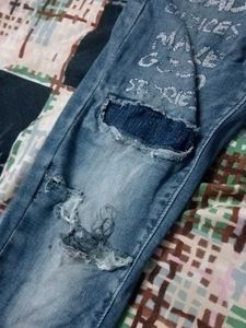 Distressed Blue Denim Jeans