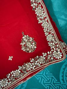 Vibrant Red Saree with Intricate Embellishments