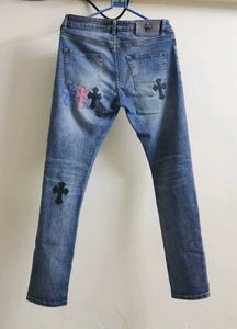 Chrome Hearts cross patch graphic blue jeans