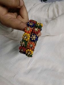 Vibrant Beaded Bangles with Flower Embellishments