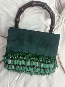 Elegant Green Suede Bag with Bamboo Handle